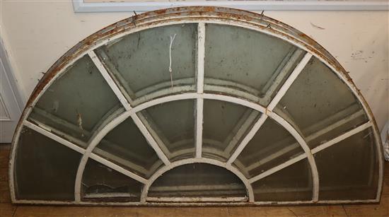 A set of three Victorian glazed metal fan lights W.152cm